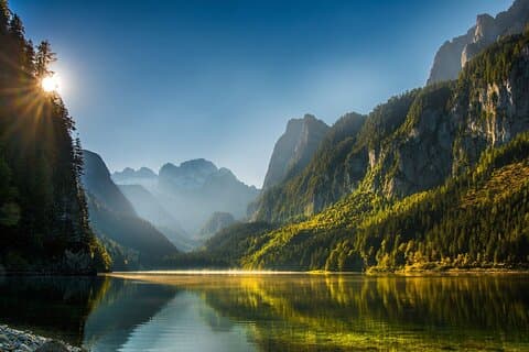Morning Serenity: Start your day away from the crowds. Breathe in the crisp air while admiring the mirror-like reflections of Lake Gosau.