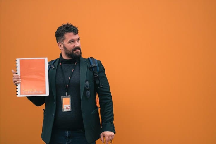Tour Guide with Folder