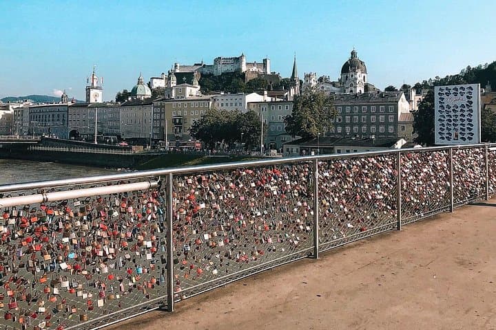 View on castle of Salzburg from bridge with millions of locks.