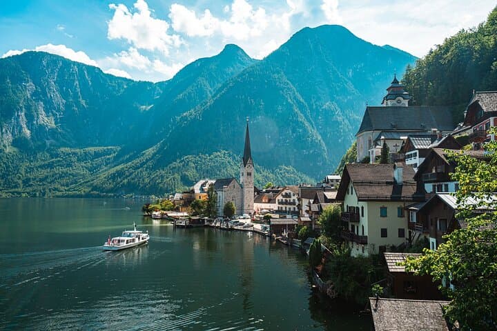 The Pearl of Austria: We arrive in Hallstatt in the afternoon—strategically avoiding the massive morning crowds so you can explore in peace.