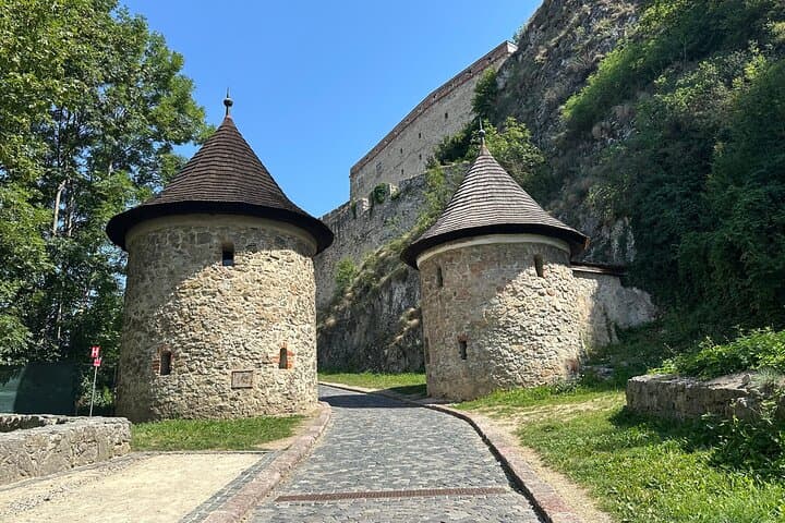 Impenetrable Defenses: Marvel at the impressive medieval bastions and watchtowers guarding the path to the upper castle.
