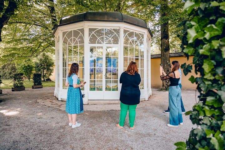 Guests visiting the famous gazebo in the Hellbrunn area, one of Salzburg’s most iconic filming locations.