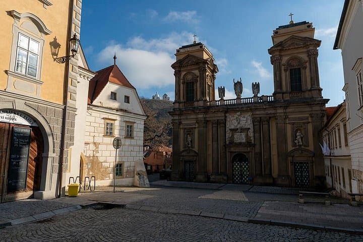 Architectural Splendor: The impressive monumental facade of the Dietrichstein Tomb on the main square.