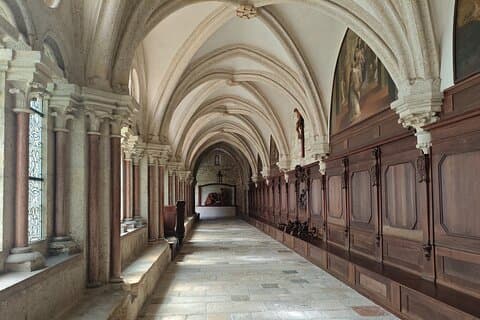 Gothic Splendor: Stroll through the breathtaking medieval cloisters of Heiligenkreuz Abbey, a place of deep spiritual peace.
