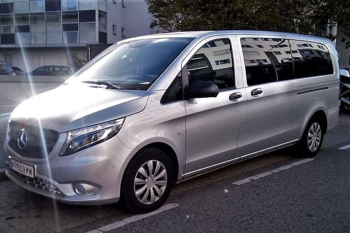 Late model sedan/van – AC, chauffeur driven