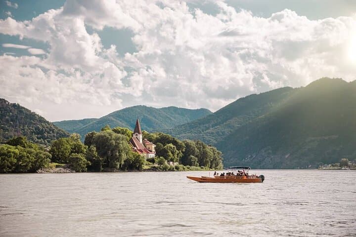 Wine tasting on traditional wooden boats in Wachau Valley