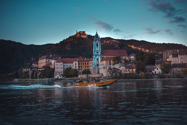 Wine tasting on traditional wooden boats in Wachau Valley