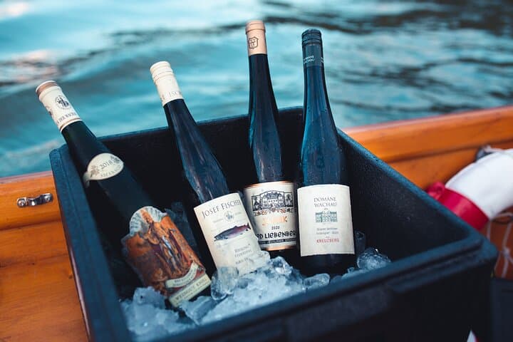 Wine tasting on traditional wooden boats in Wachau Valley