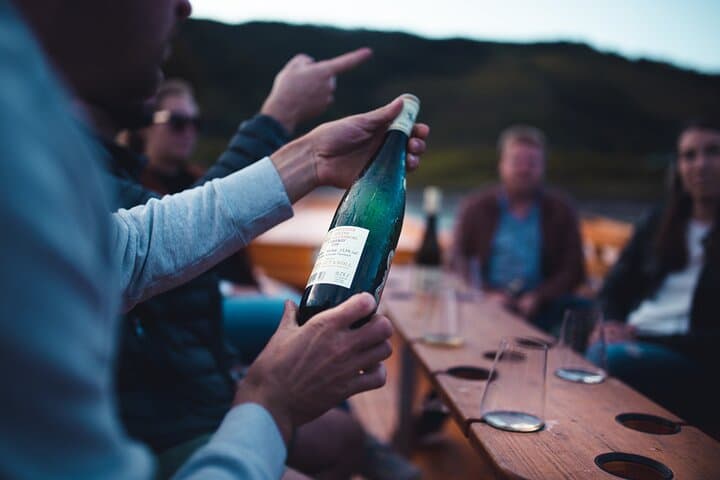 Wine tasting on traditional wooden boats in Wachau Valley