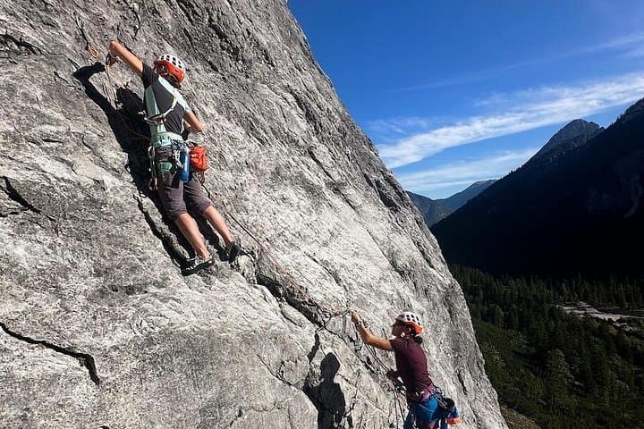 Multi-pitch climbing amidst the stunning autumn hues near Innsbruck.
