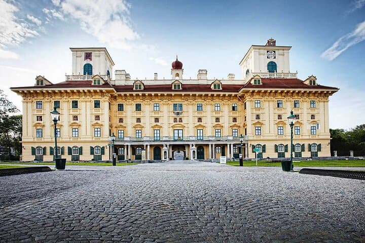 A Royal Welcome: Arrive at the majestic gates of Esterházy Palace, a true architectural masterpiece in Eisenstadt.