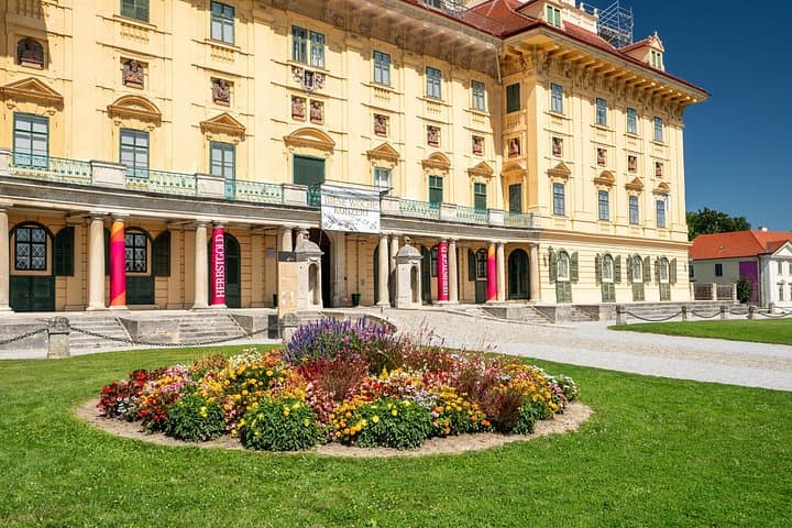 Baroque Splendor: The vibrant facade of Esterházy Palace, once the lavish residence of one of Austria's most powerful noble families.
