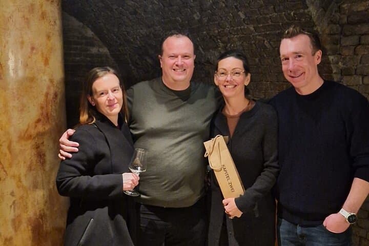 Happy tourists from Canada after a master class in a cellar deep under the streets of Vienna.
