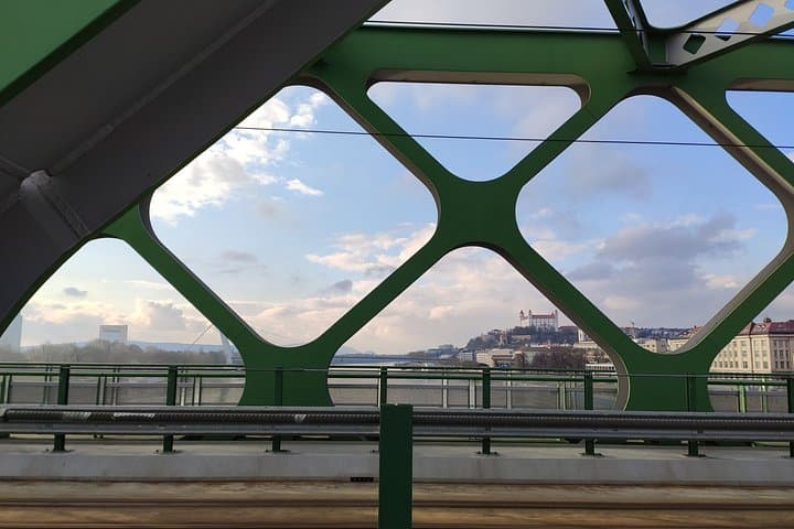 The Danube Views: Enjoy picturesque views of the iconic Bratislava Castle framing the famous green arches of the Old Bridge.